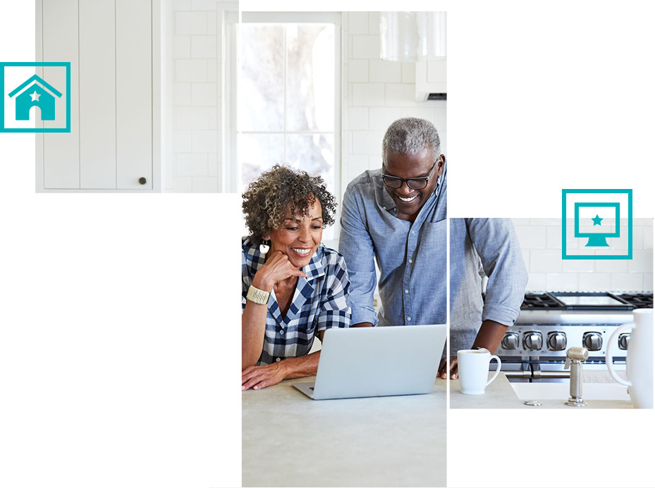 Couple at kitchen counter on laptop computer